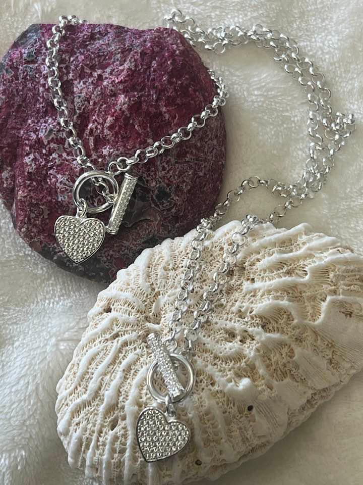 Sterling silver heart hand chain and necklace set.