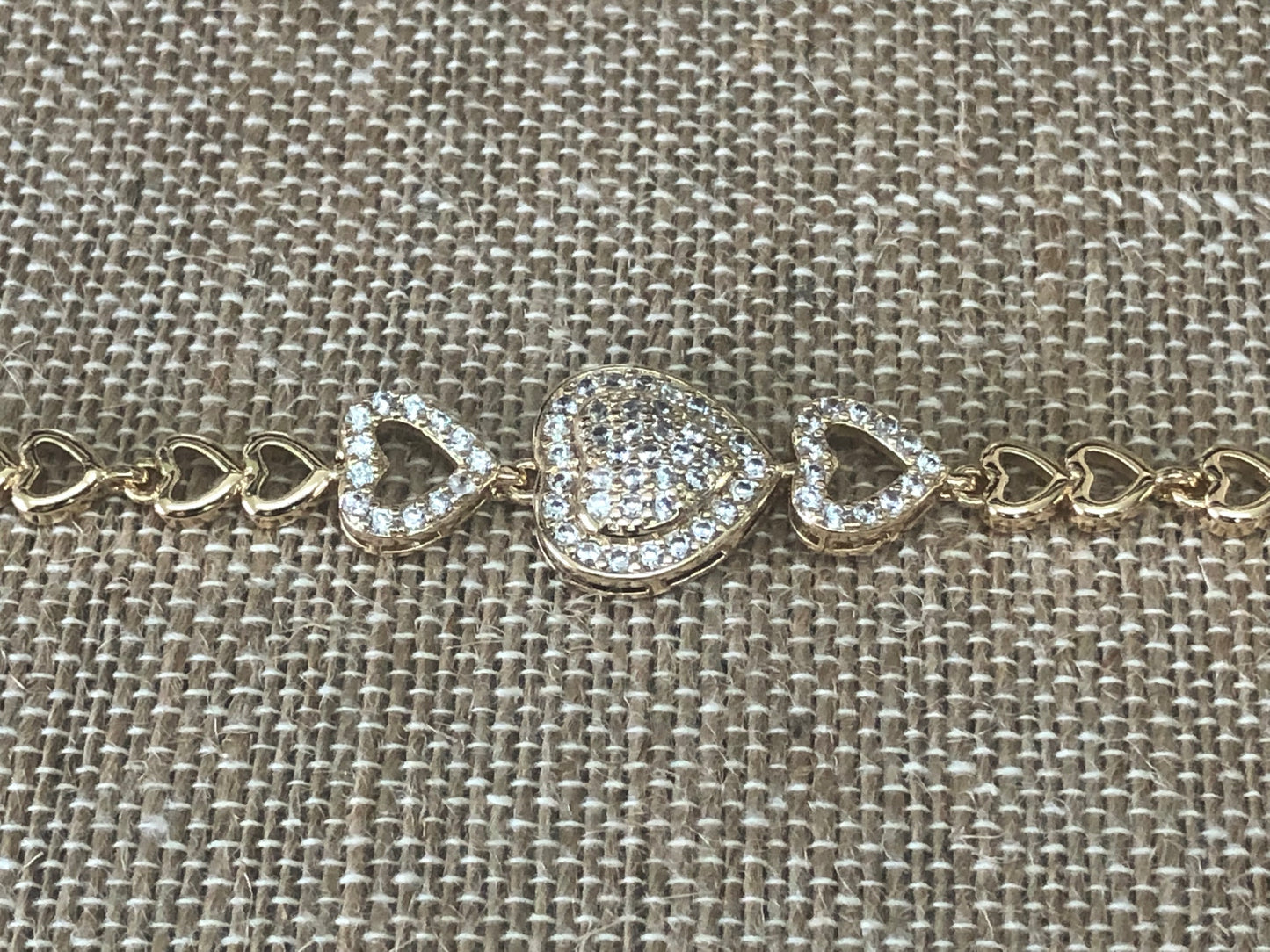 Three hearts gold plated hand chain 7 1/2 inches
