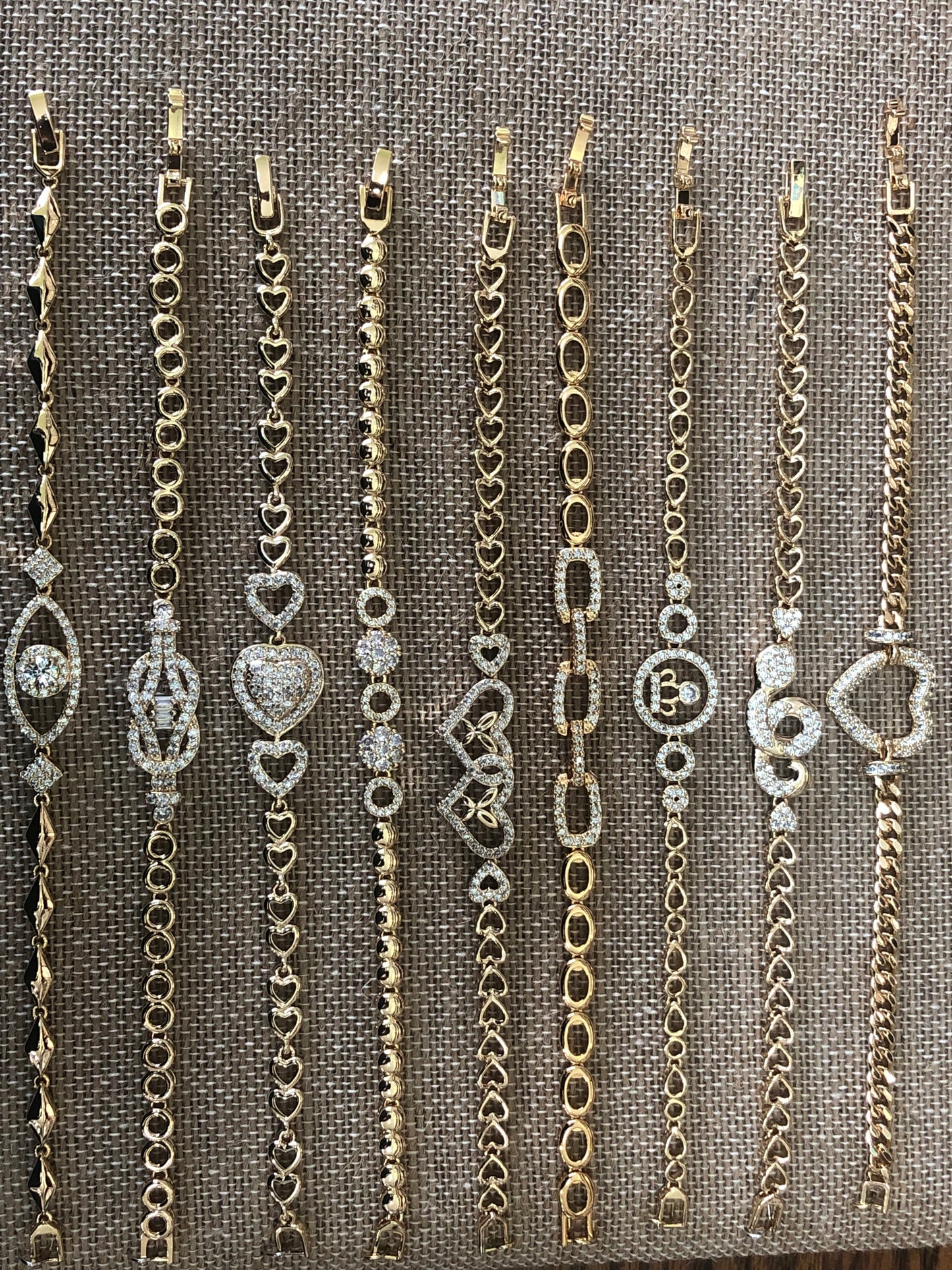 Heart gold plated hand chain .