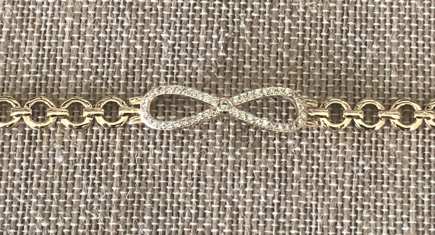 Infinity gold plated hand chain 7 1/2 inches