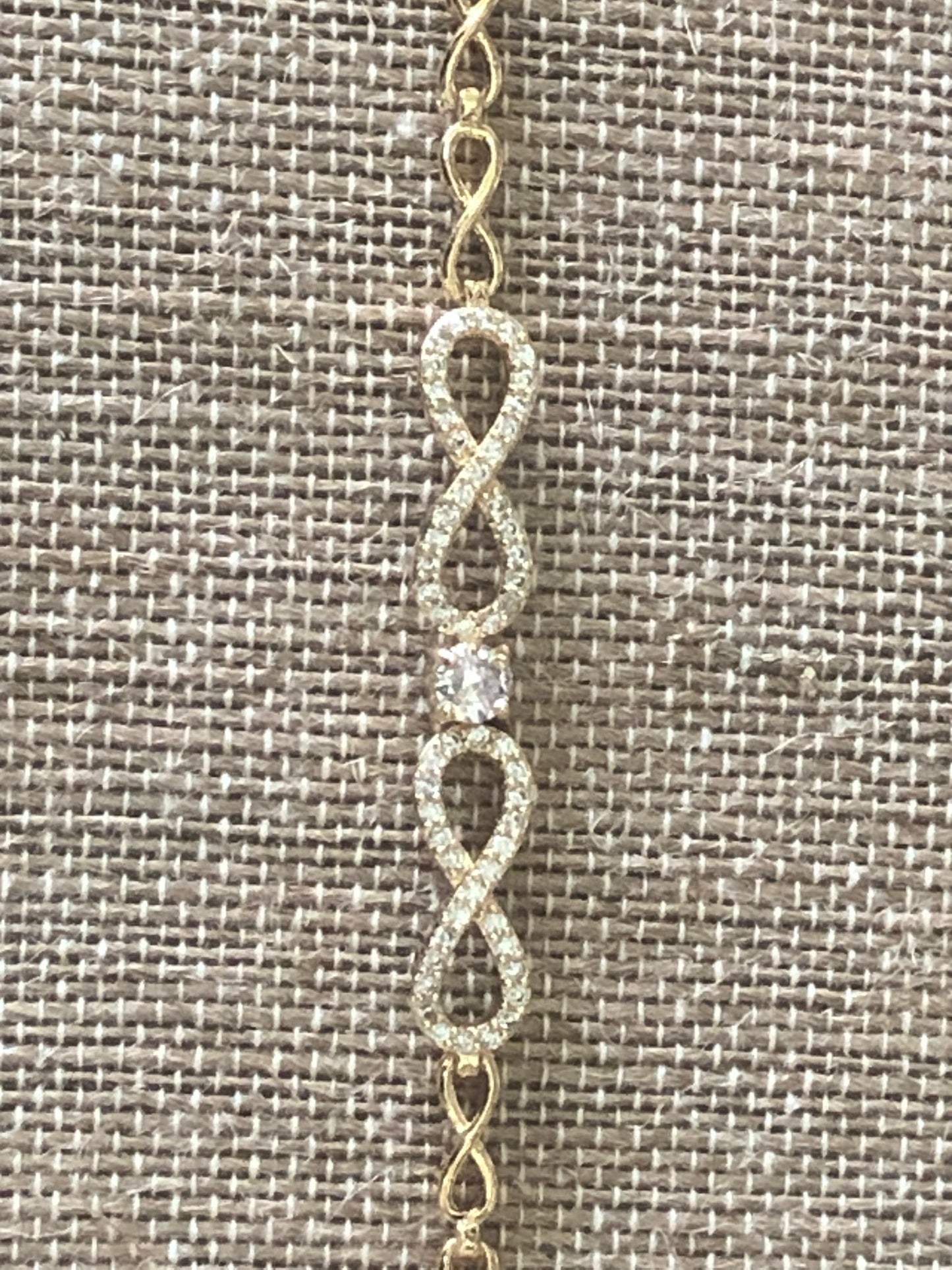 Double infinity gold plated hand chain 7 1/2 inches.