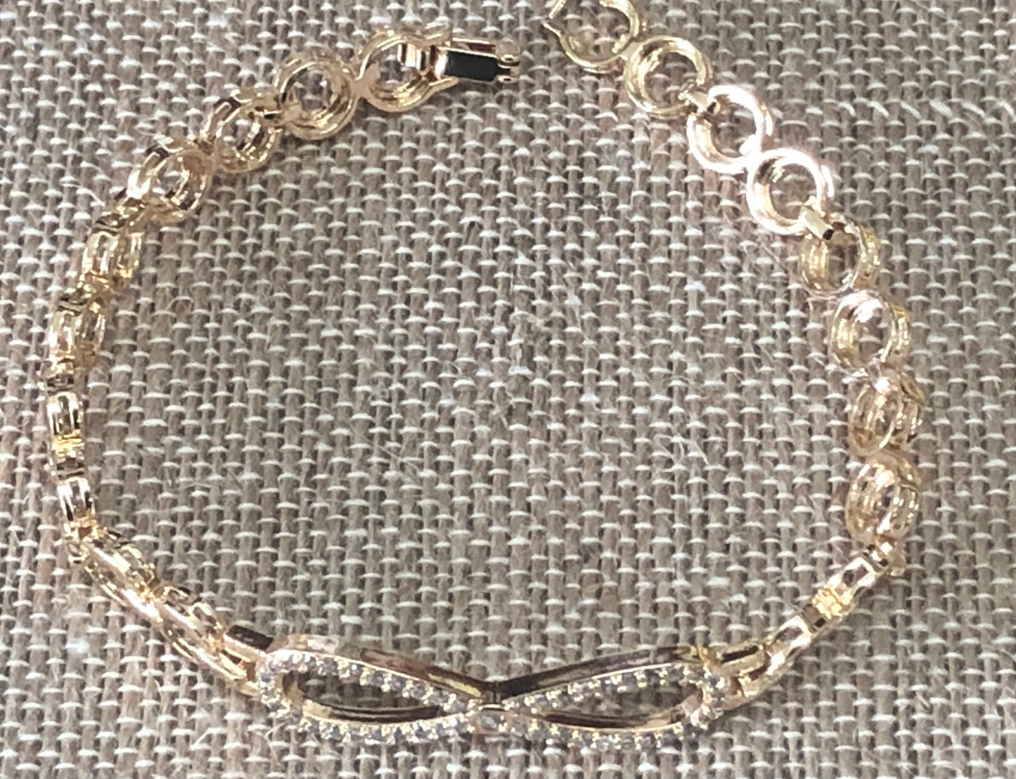 Infinity gold plated hand chain 7 1/2 inches