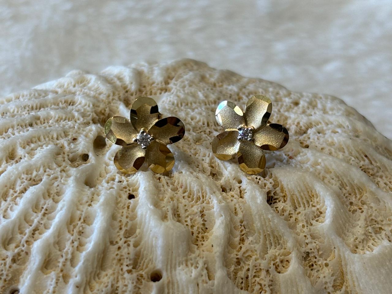 14 k and 10 k solid gold flower studs earrings.