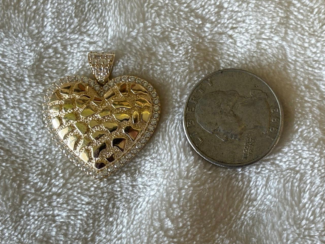 Solid 10 k gold Heart-nugget pendant.