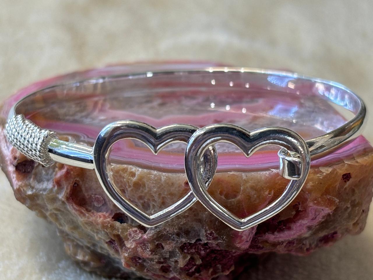 Sterling silver hearts bracelet.