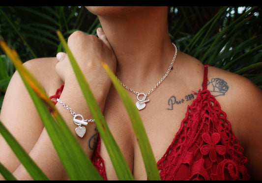 Sterling silver heart hand chain and necklace set.