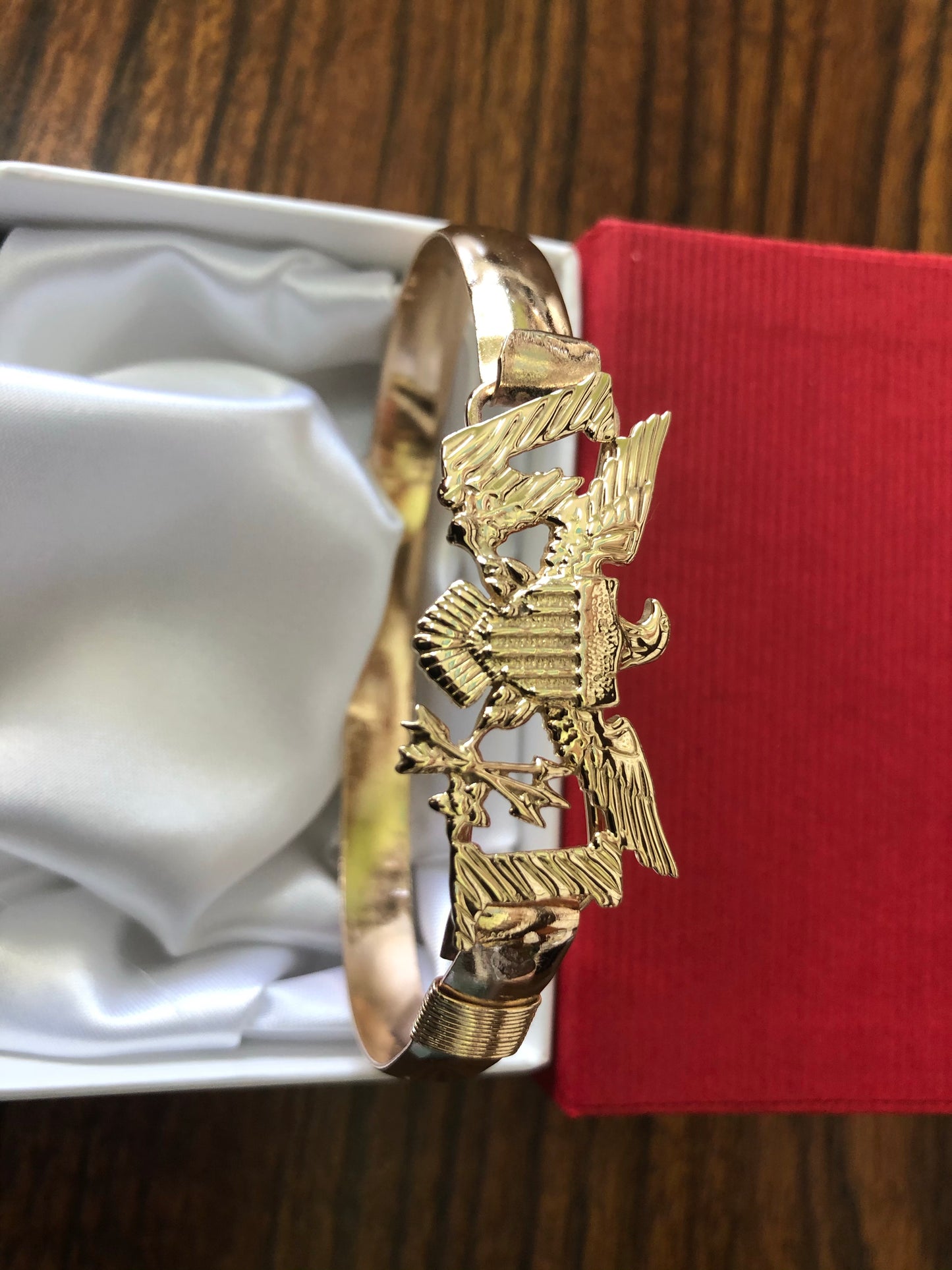 Solid 14k and 10 k gold Eagle with goldfilled wire bracelet .