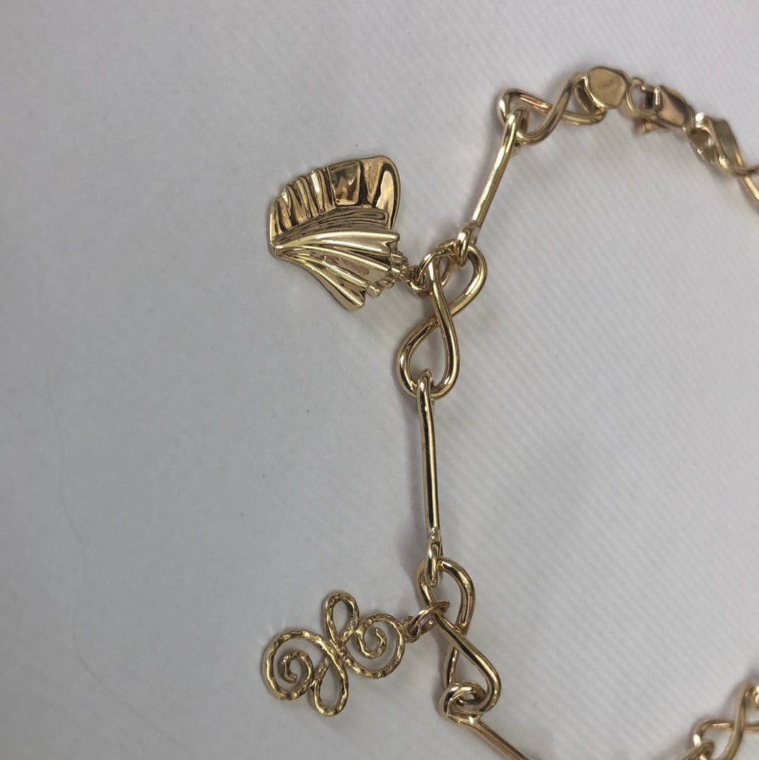 Solid 14 k gold and 10 k gold charms anklet.