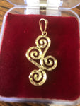 Solid 14k and 10 k gold Swirly-Curly Pendant.