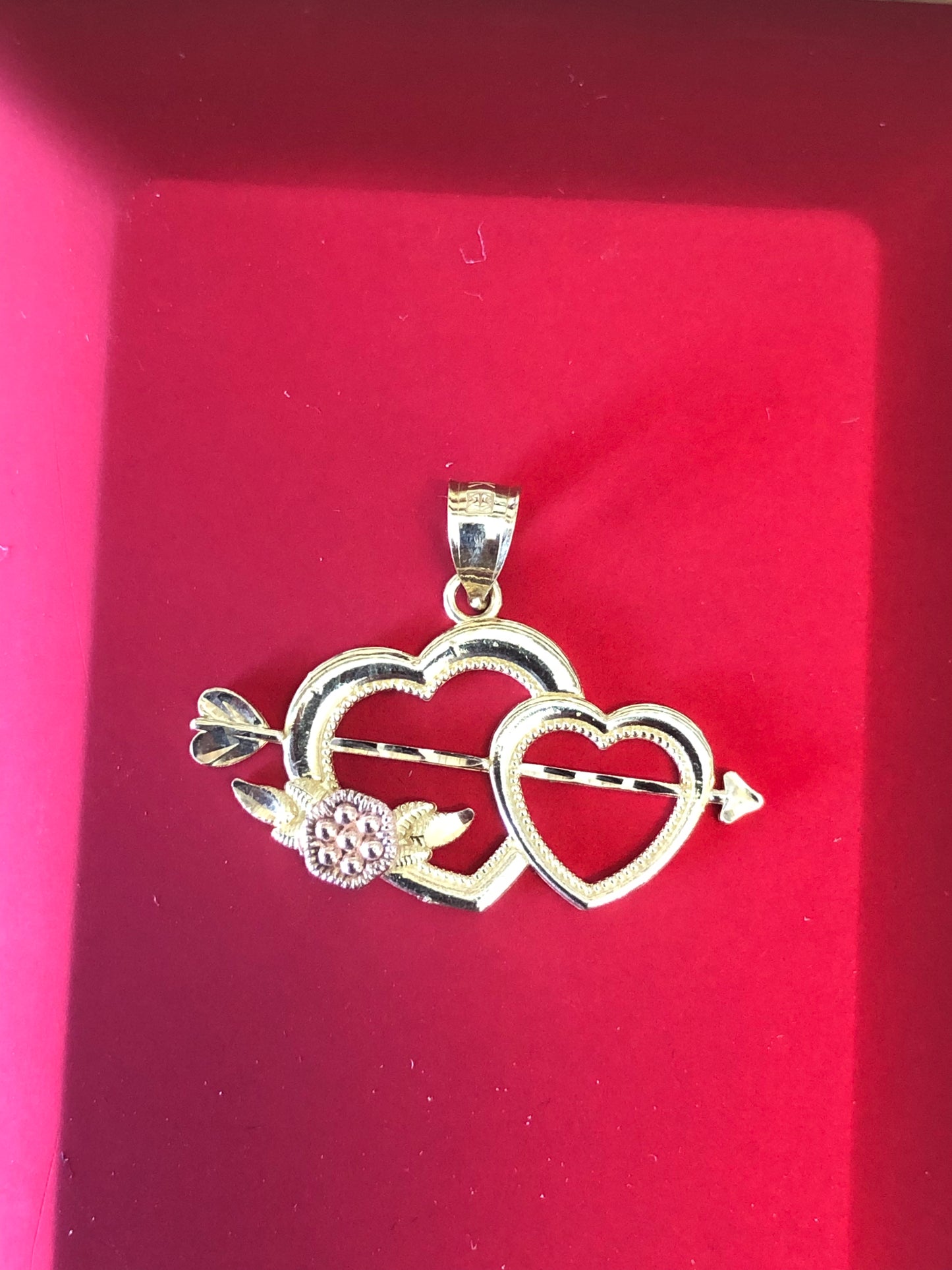 Solid 14 k gold two hearts pendant.