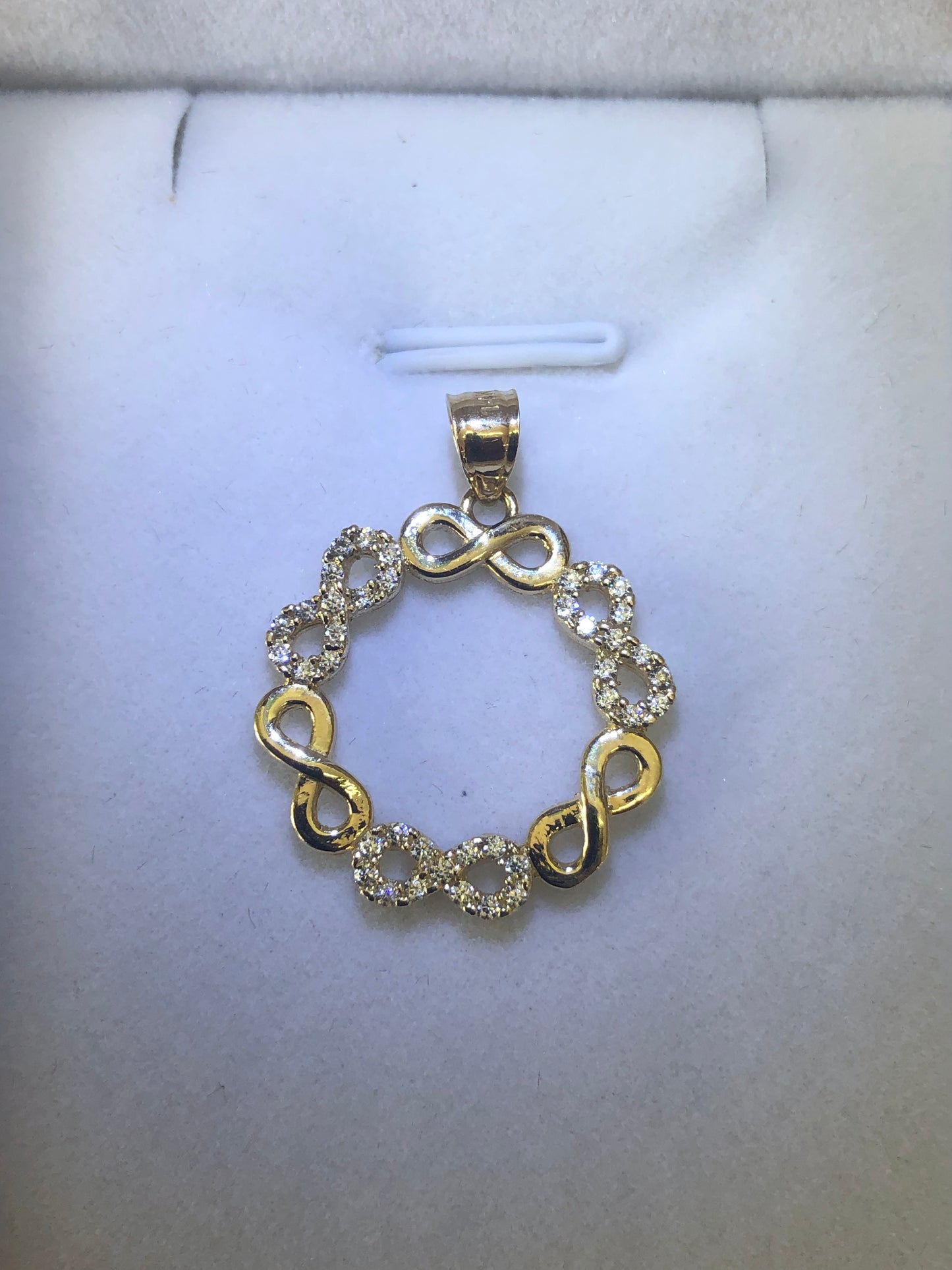 14 k gold infinity pendant.