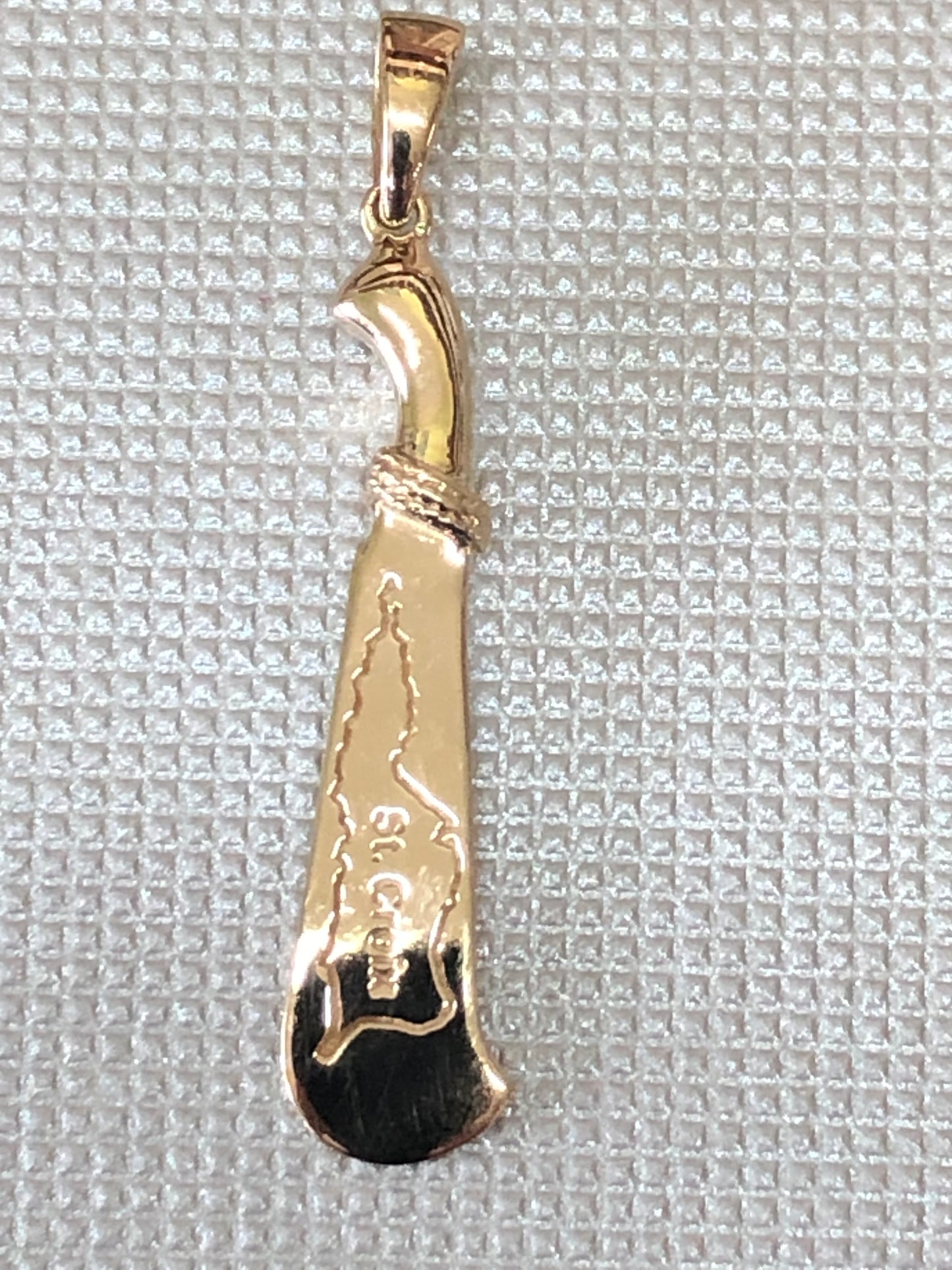 Solid 10 k gold Machete pendant collection.