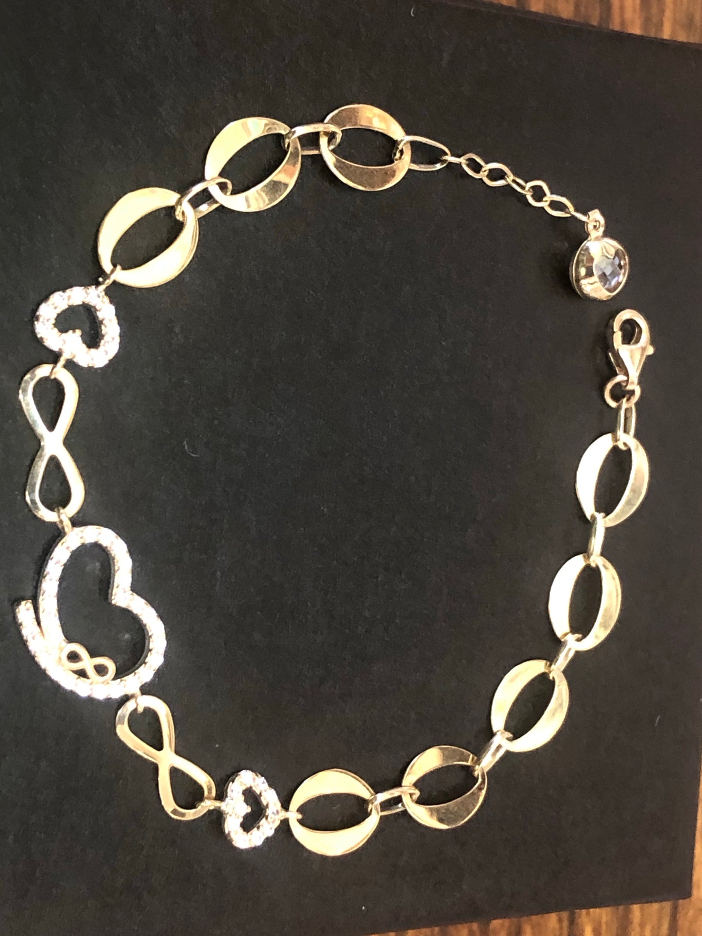 Solid 14 k gold heart infinity 8 inches adjustable hand chain.