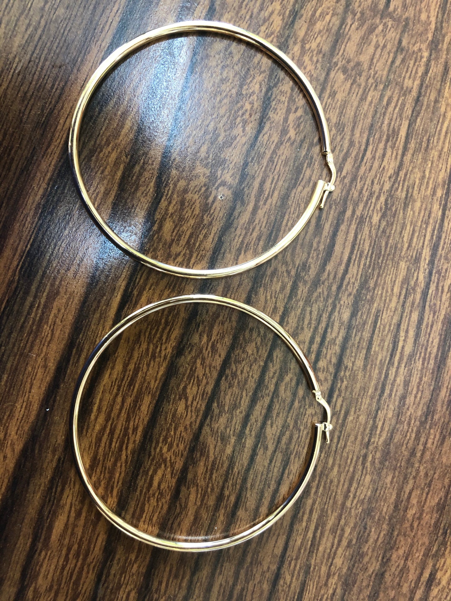 Solid 14 k gold Hoops earrings.