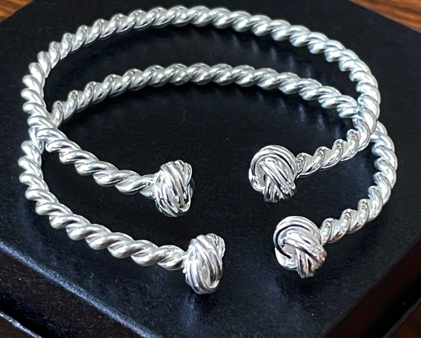 2 sterling silver twisted wire bracelets.