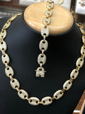 Gold layered Gucci bracelet and necklace with lovely stones setting.
