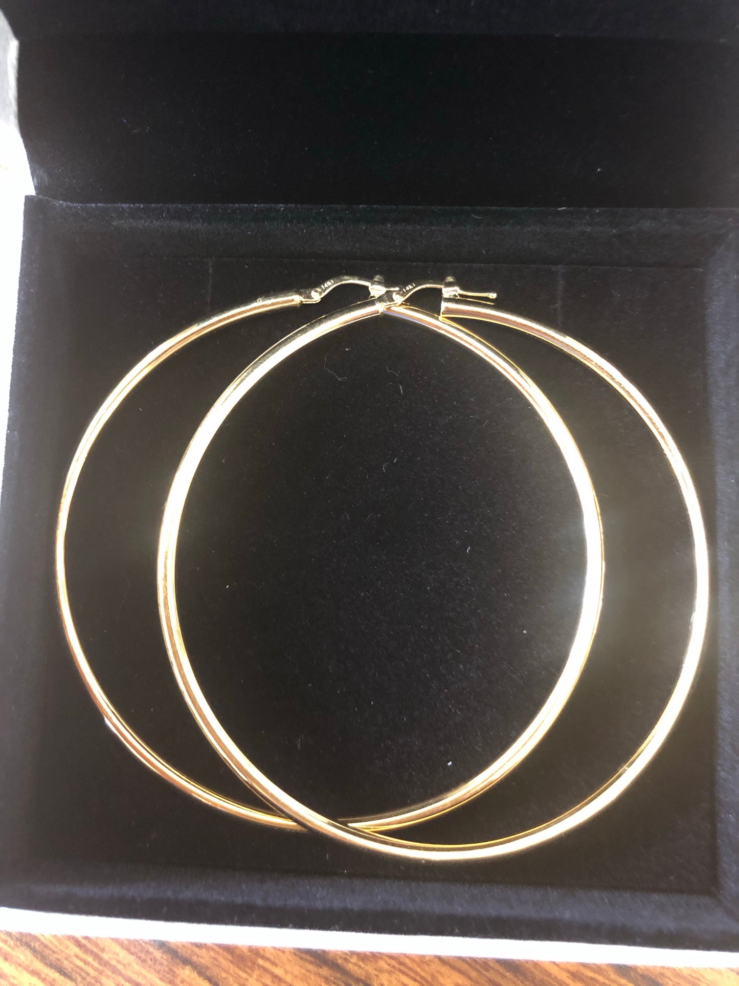 Solid 14 k gold Hoops earrings.