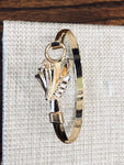 Gold plated conch shell bracelet . Size 7 1/2