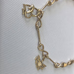 Solid 14 k gold and 10 k gold charms anklet.