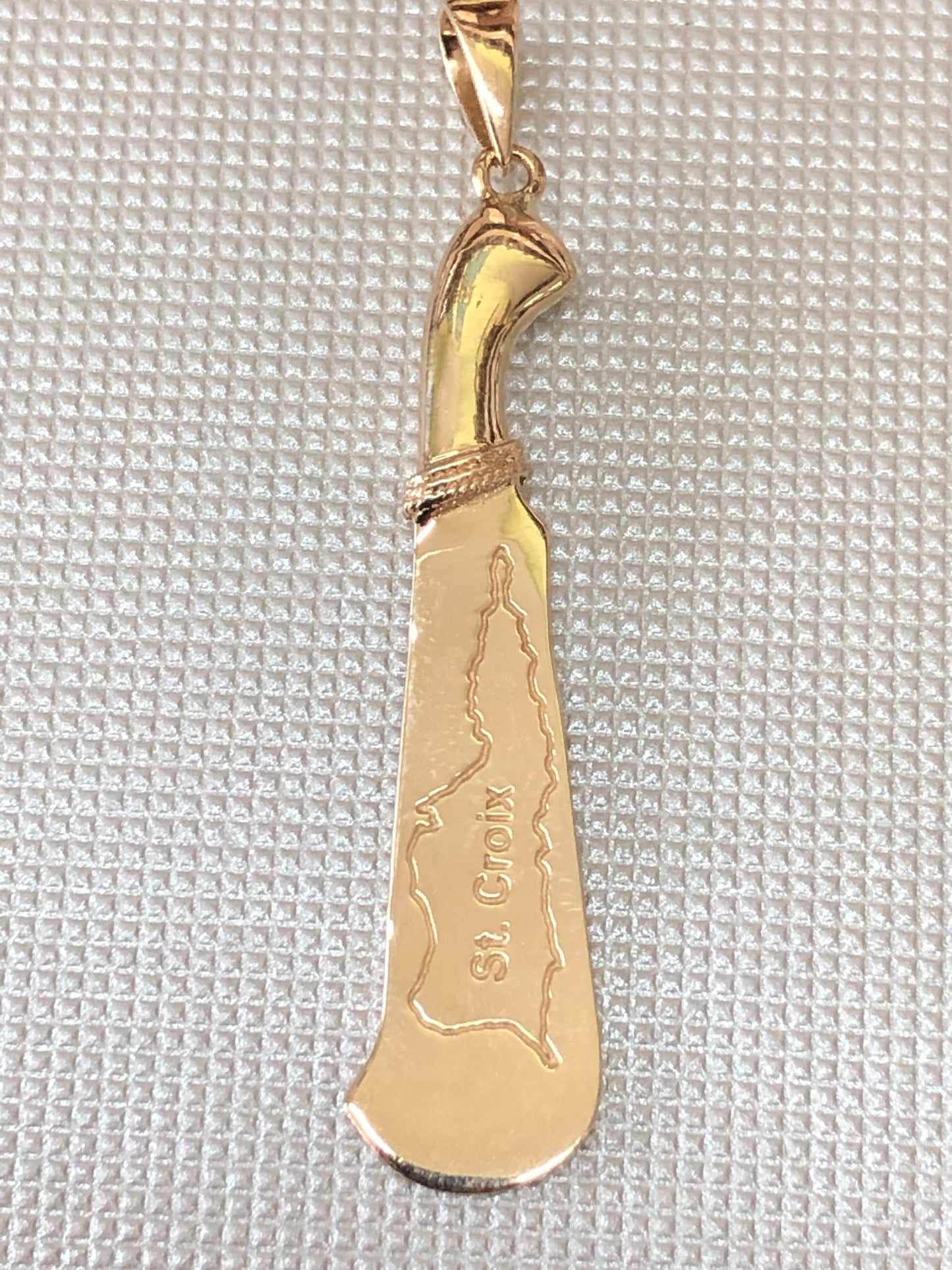 Solid 10 k gold Machete pendant collection.