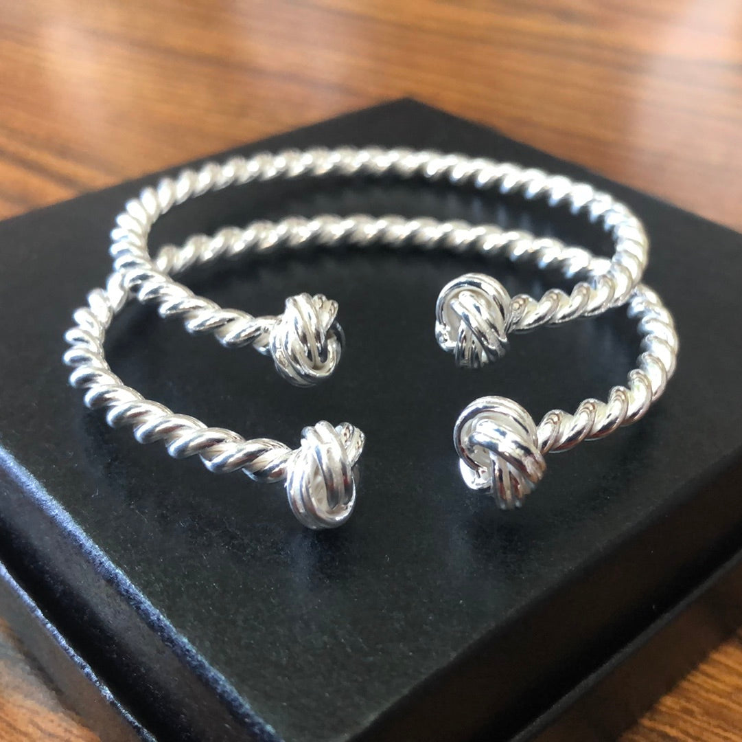 2 sterling silver twisted wire bracelets.