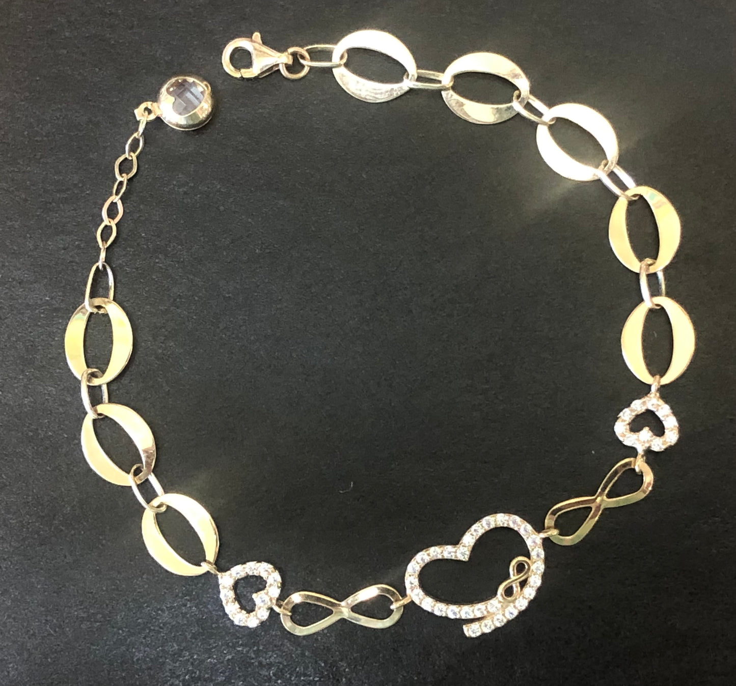 Solid 14 k gold heart infinity 8 inches adjustable hand chain.