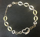 Solid 14 k gold heart infinity 8 inches adjustable hand chain.