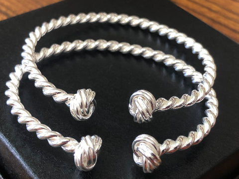 2 sterling silver twisted wire bracelets.