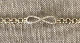 Infinity gold plated hand chain 7 1/2 inches