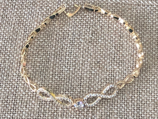 Double infinity gold plated hand chain 7 1/2 inches.