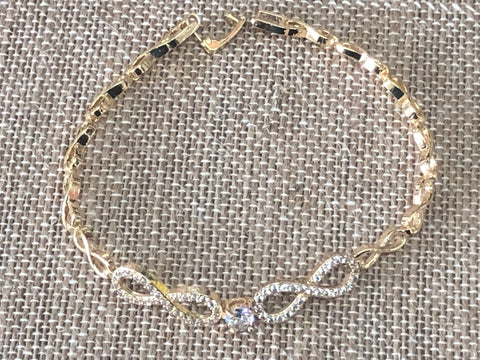 Double infinity gold plated hand chain 7 1/2 inches.