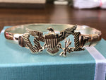 Solid 14k and 10 k gold Eagle with goldfilled wire bracelet .